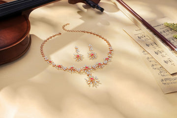 A sparkling necklace and earrings with musical notes