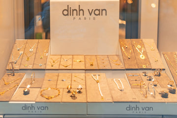 Dinh van paris jewelry displayed in a store window.