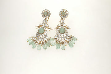 Beautiful ornate earrings with light green beads and clear stones