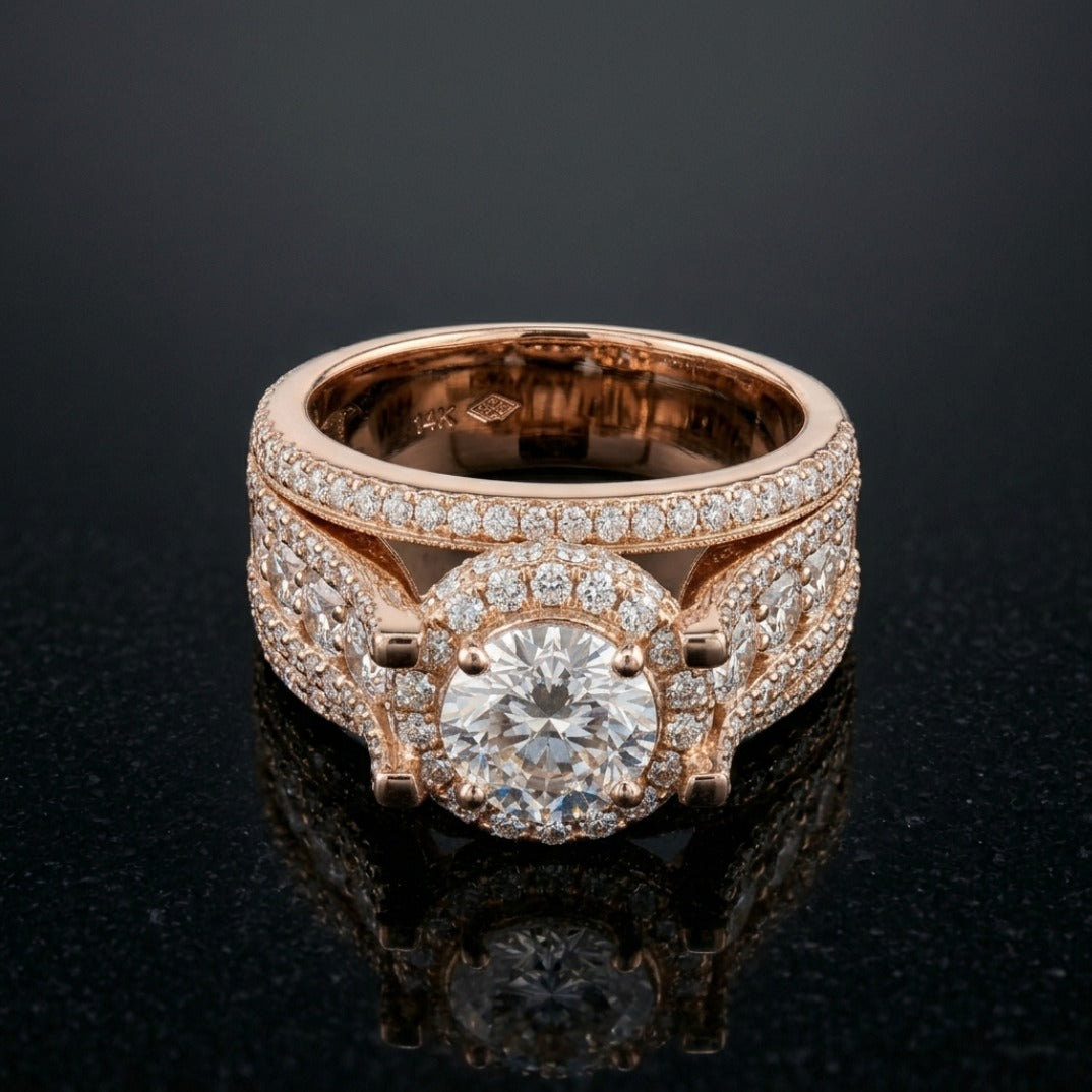 Rose gold ring with diamond accents on a black background