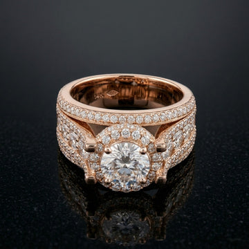 Rose gold ring with diamond accents on a black background