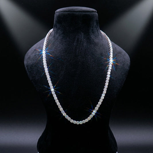 Pearl necklace on a black mannequin bust with dramatic lighting